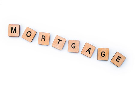 The word MORTGAGE, spelt with wooden letter tiles.