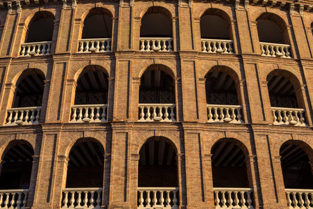 A view of the exterior of the Bullring of Valencia, also known as the Plaza de Toros de Valencia, in the the historic city of Valencia in Spain.の写真素材