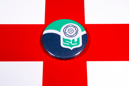 A badge portraying the flag of the English county of South Yorkshire, pictured over the England flag.の写真素材