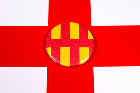 A badge portraying the flag of the English county of Northumberland, pictured over the England flag.の写真素材