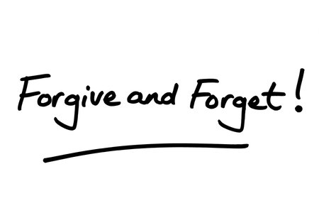 Forgive and Forget! handwritten on a white background.の写真素材