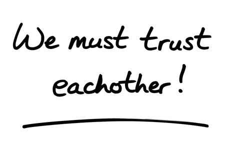 We must trust eachother! handwritten on a white background.の写真素材