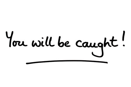 You will be caught! handwritten on a white background.の写真素材