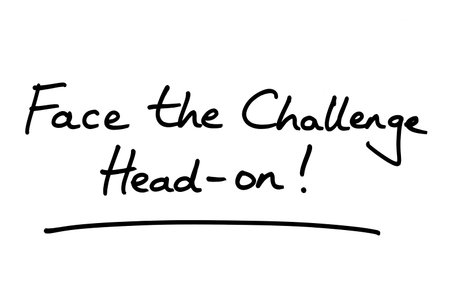Face the Challenge Head-on! handwritten on a white background.の写真素材