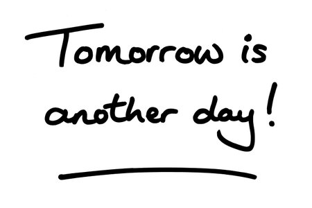 Tomorrow is another day! handwritten on a white background.の写真素材