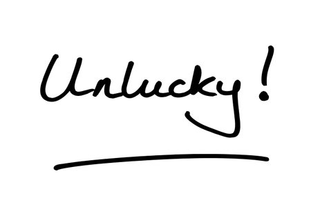 The word Unlucky! handwritten on a white background.の写真素材