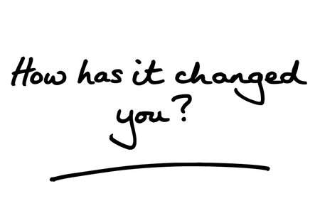How has it changed you? handwritten on a white background.の写真素材