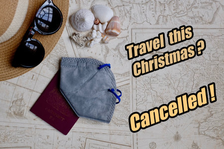 Christmas Travel Cancelled Covid mask, holiday things on world mapの写真素材