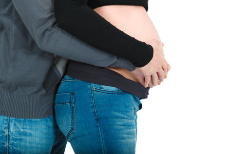 Man posing with his pregnant wifeの写真素材