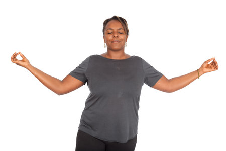 Beautiful black woman doing different expressions in different sets of clothesの写真素材