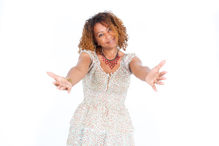 Beautiful black woman doing different expressions in different sets of clothesの写真素材