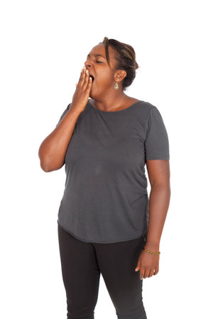 Beautiful black woman doing different expressions in different sets of clothesの写真素材