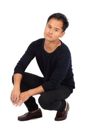 Handsome man doing different expressions in different sets of clothes: posingの写真素材