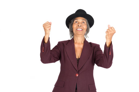 Beautiful woman doing different expressions in different sets of clothes: arms raisedの写真素材