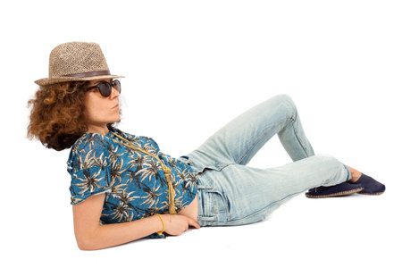 Beautiful woman doing different expressions in different sets of clothes: posing with hat and sunglassesの写真素材