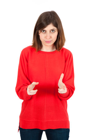 Beautiful woman doing different expressions in different sets of clothes: gun signの写真素材