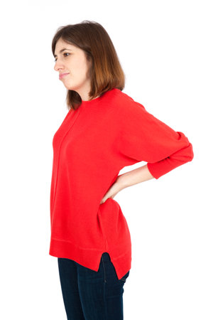 Beautiful woman doing different expressions in different sets of clothes: backacheの写真素材