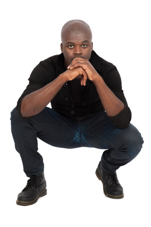 Handsome man doing different expressions in different sets of clothes: posingの写真素材