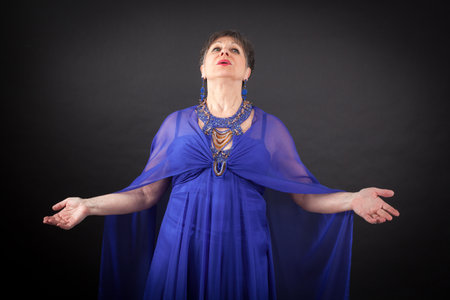 Beautiful woman doing different expressions in different sets of clothes: joyの写真素材