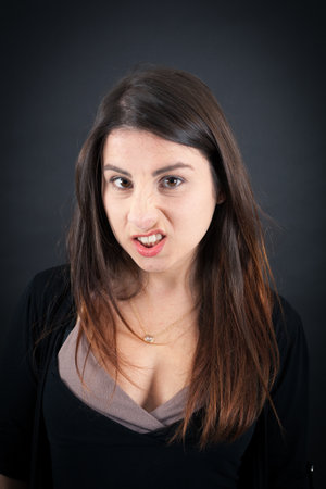Beautiful woman doing different expressions in different sets of clothes: angry