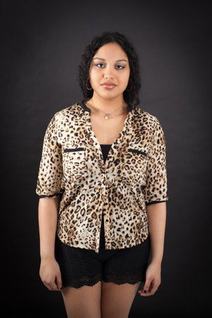 Beautiful woman doing different expressions in different sets of clothes: thinkingの写真素材