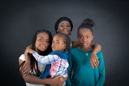 Beautiful family doing different expressions in different sets of clothes: pointingの写真素材