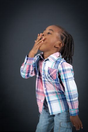 Handsome boy doing different expressions in different sets of clothes: yawningの写真素材