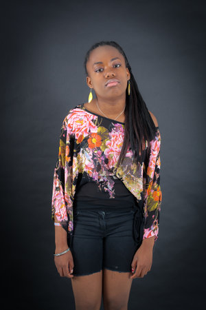 Beautiful girl doing different expressions in different sets of clothes: sadの写真素材