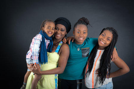 Beautiful family doing different expressions in different sets of clothes: pointingの写真素材