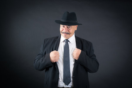 Handsome man doing different expressions in different sets of clothes: angryの写真素材