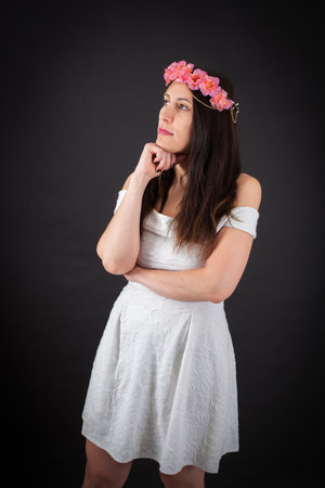 Beautiful woman doing different expressions in different sets of clothes: thinkingの写真素材