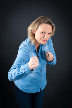 Beautiful woman doing different expressions in different sets of clothes: boxeの写真素材