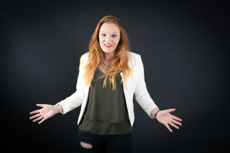 Beautiful woman doing different expressions in different sets of clothes: surpriseの写真素材