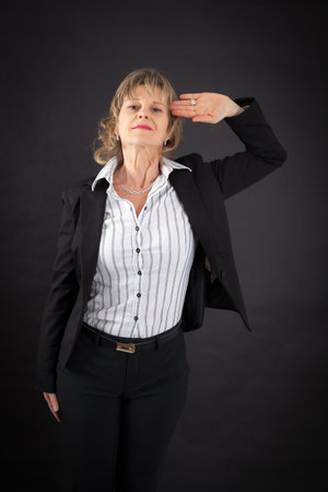 Beautiful woman doing different expressions in different sets of clothes: at attention