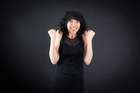 Beautiful woman doing different expressions in different sets of clothes: arms raised