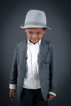 Handsome boy doing different expressions in different sets of clothes: boredの写真素材