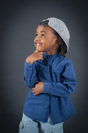 Handsome boy doing different expressions in different sets of clothes: thinkingの写真素材