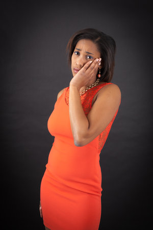 Beautiful woman doing different expressions in different sets of clothes: toothacheの写真素材
