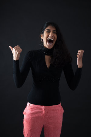 Beautiful woman doing different expressions in different sets of clothes: arms raised