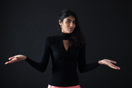 Beautiful woman doing different expressions in different sets of clothes: welcomeの写真素材