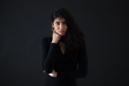 Beautiful woman doing different expressions in different sets of clothes: surpriseの写真素材