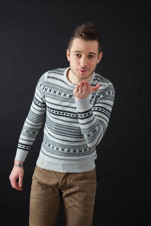 Handsome men doing different expressions in different sets of clothes: kissの写真素材