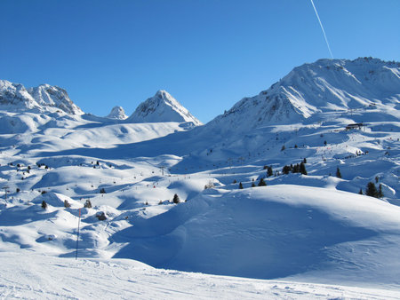 Alpine mountain range under a deep blue skyの写真素材