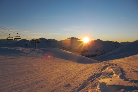 Sunset over an alpine mountain rangeの写真素材