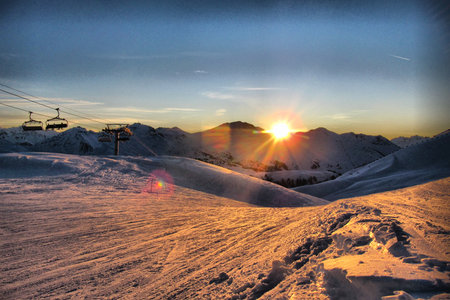 Sunset over an alpine mountain rangeの写真素材