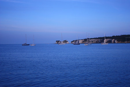 yachts moored in studland bay at dusk