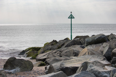 pile of large rocks acting as sea defencesの写真素材