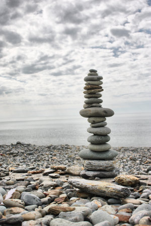 stones balancing on top of each to make a tower on a beachの写真素材