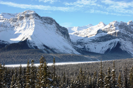 Canadian mountain in front of a frozen lakeの写真素材