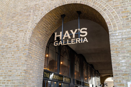 LONDON, UK - APRIL 1, 2019: Sign and the entrance to Hay's Galleria on the South Bank in Londonのeditorial素材